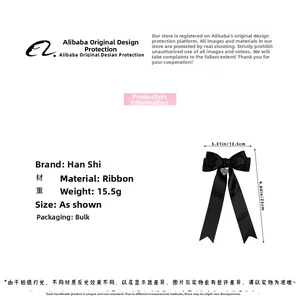 Detailed view of black ribbon bow hair clip with engraved heart pendant and dimensions