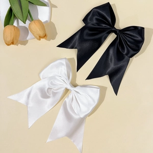 Elegant set of black and white satin ribbon bow hair clips with long tassels for women