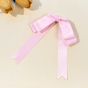 Elegant pink satin ribbon bow hair clip with long streamers and tulip decoration