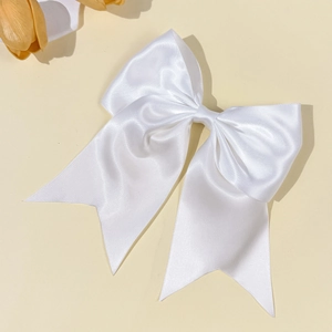 Large white satin bow hair clip for women featuring elegant silk texture and long ribbons