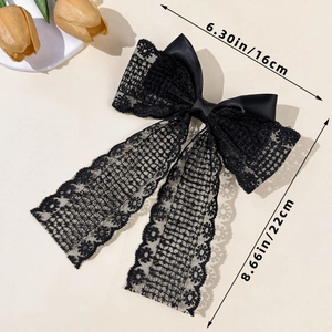Detailed view of black lace bow hair clip showing dimensions 16cm width and 22cm length