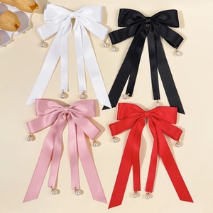 Elegant satin bow hair clip with pearl pendants in white, black, pink, and red colors