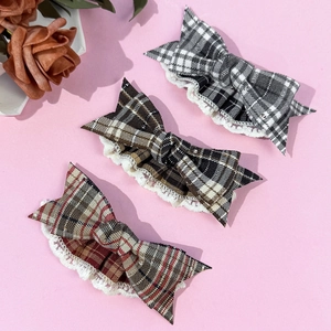 Three-piece plaid bow hair clip set with lace trim and retro aesthetic design