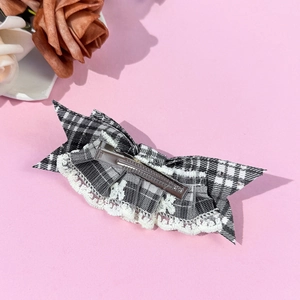 Classic black and white plaid bow hair clip with lace trim and silver metal duckbill clip