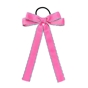 Pink ribbon bow hair tie with green wavy edges and long streamers on white background