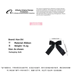 Detail of black ribbon bow hair clip with silver star charm showing 11x13.5cm dimensions