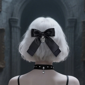 Gothic black satin bow hair clip with silver star pendant worn on silver-white hair