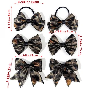 Size chart for leopard print bow hair clips showing dimensions in inches and centimeters