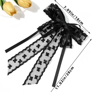 Detail view showing dimensions of a black lace bow hair clip with long satin ribbons