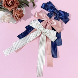 Polka dot satin bow hair clips with long streamers in navy blue, pink and white