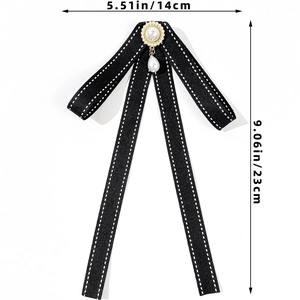 Detail showing dimensions of black bow tie brooch with pearl accent and polka dot edges