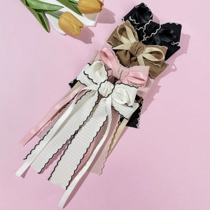 Elegant bow hair clips with long tassels in four colors for a sophisticated vintage look