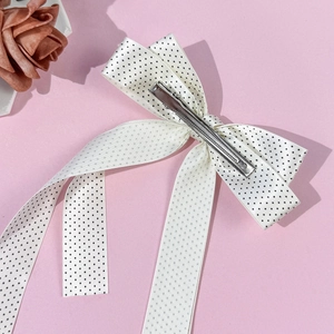 Polka dot bow hair clip with long tails and silver metal alligator grip for women