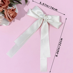 Polka dot bow hair clip measuring 14cm wide and 22cm long for elegant hair styling