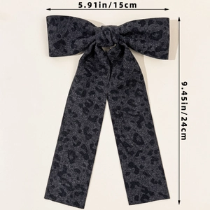 Detailed dimensions of a vintage leopard print hair bow measuring 5.91 by 9.45 inches