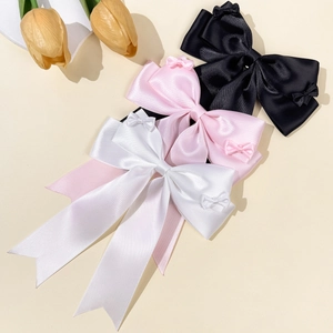 Set di tre fermagli per capelli con fiocco in raso nero, rosa e bianco con lunghi nastri