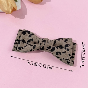 Elegant leopard print bow hair clip with double layer fabric design and size measurements