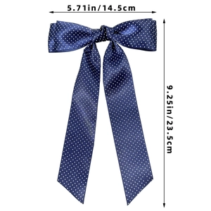 Detailed view of the dark blue polka dot satin bow clip with dimension measurements