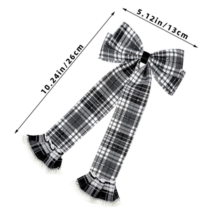 Detailed view of large plaid bow hair clip with lace trim and size measurement display