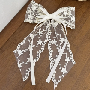Elegant white lace bow hair clip with long ribbons in sweet French vintage style
