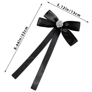 Detailed view of black satin bow with silver rose showing dimensions 22cm by 13cm