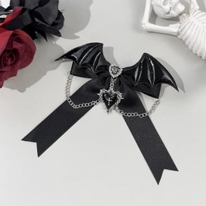 Gothic black bow hair clip with bat wings, silver heart cross pendant, and chain detail