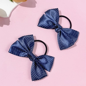 Detail of navy blue bow hair ties with white polka dots and high-elastic rubber bands