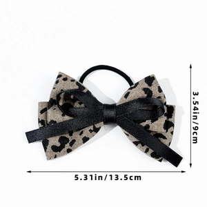 Leopard print bow hair tie with satin layers and 13.5cm size dimension on white background