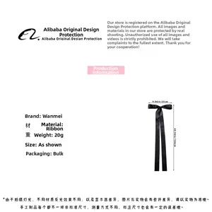 Detailed view of black ribbon bow hair clip with extra long 104cm streamers