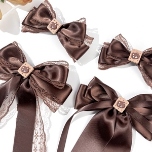 Brown lace bow hair clips with cute bear cookie accents for an elegant women's hair accessory