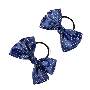Set of two navy blue polka dot bow hair ties made of soft satin fabric for women
