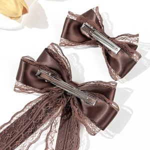 Brown lace bow hair clip set with long ribbon streamers and elegant satin finish