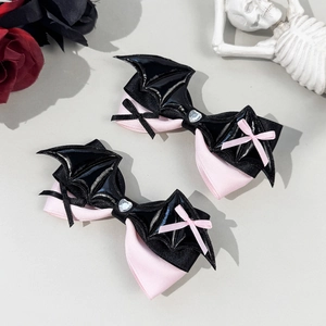 Lolita style pink bow hair clips with black bat wings and heart rhinestone center