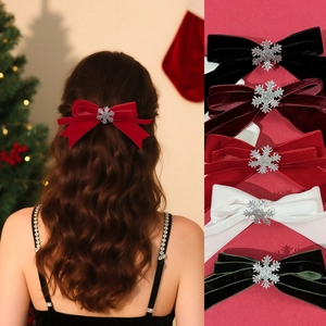 Velvet Christmas bow hair clips with silver snowflake patterns in five festive colors