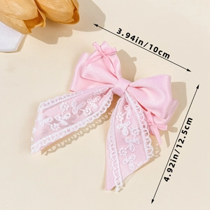 Pink satin bow hair clip with white lace trim and long ribbons, width 10cm by height 12.5cm