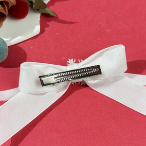 Elegant white velvet snowflake bow hair clip with a silver crocodile clip for women