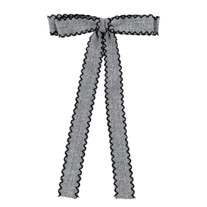Elegant grey fabric bow hair clip with black scalloped edges for women's hair styling