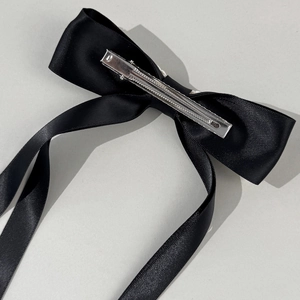 Elegant black satin double bow hair clip with long ribbons and metal alligator clip