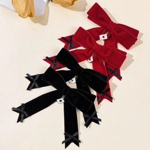 Velvet bow hair clips with poker card pendants in red and black vintage aesthetic