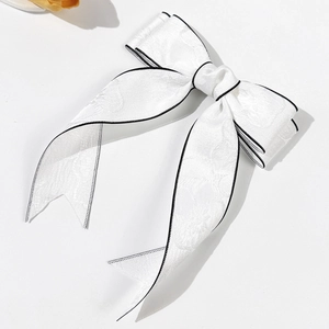 Barrette à nœud papillon blanche en jacquard avec bordure noire et rubans