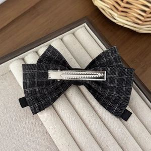 French vintage houndstooth bow hair clip with rhinestones on beige velvet box