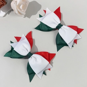 Pair of festive red white and green ribbon bow hair clips for girls minimalist style