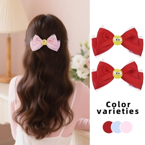Rosa und rote Satin-Haarschleifen mit Spitzenbesatz und lustigen Cartoon-Augen-Details