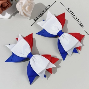Set of two red white and blue ribbon bow hair clips measuring 12.5cm by 9.5cm