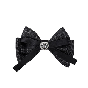 French vintage houndstooth bow hair clip with rhinestone heart gem on white background