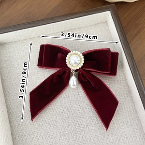 Detailed view of dark red velvet bow hair clip with pearls measuring 3.54in or 9cm size
