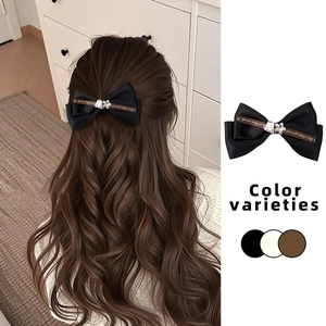 Elegant black bow hair clip with rhinestones and ribbon detail for women's hairstyle