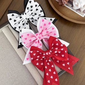 Three-piece set of heart-printed ribbon bow hair clips in white, pink, and red colors