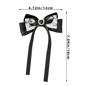Detailed macro view of a Lolita velvet lace bow hair clip with a black heart gemstone