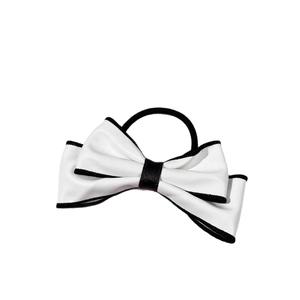 Elegant white leather bow hair tie with black contrast edges and high elasticity band